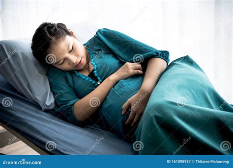 Pregnant Asian Woman Is Lying On A Patient`s Bed Stock Image Image