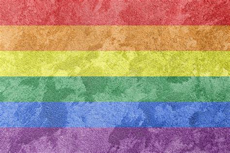 Rainbow Lgbtq Or Gay Pride Grunge Flag On Concrete Wall Texture Abstract Background Stock Photo