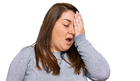 Beautiful Brunette Plus Size Woman Wearing Casual Clothes Yawning Tired Covering Half Face Eye