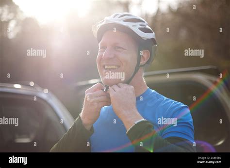 Portrait Smiling Man Fastening Bike Helmet Stock Photo Alamy