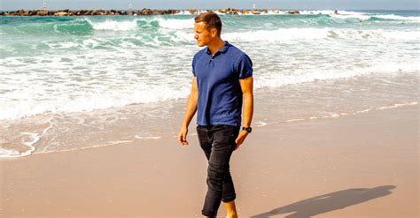 Man Walking Barefoot along Beach · Free Stock Photo