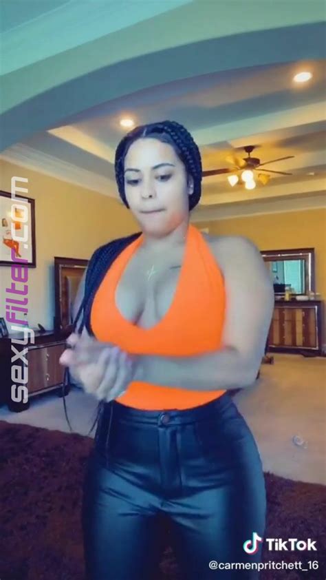 Hot Carmen Pritchett Shows Cleavage In Electric Orange Top Sexyfilter