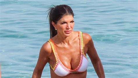 Teresa Giudice Rocks Purple And Green Swimsuit In Miami Photos