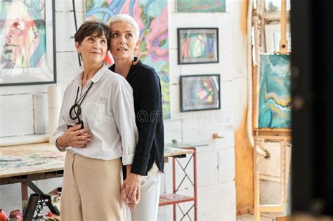 Impressed And Stylish Mature Woman Embracing Stock Photo Image Of Lesbian Painters