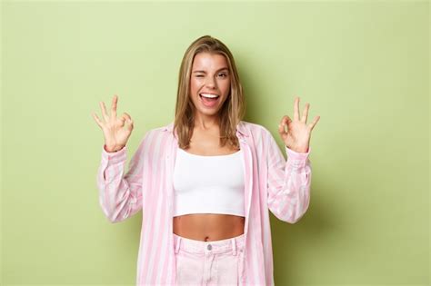 Premium Photo Blonde Girl In A Pink Outfit Posing