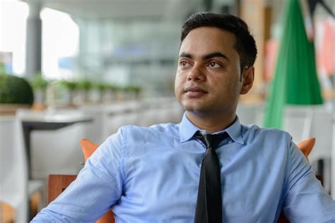 Premium Photo Portrait Of Young Handsome Indian Businessman In The City