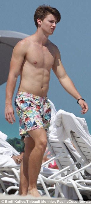 Shirtless Patrick Schwarzenegger Gets Cradled By Bikini Clad Brunette In The Miami Surf Daily