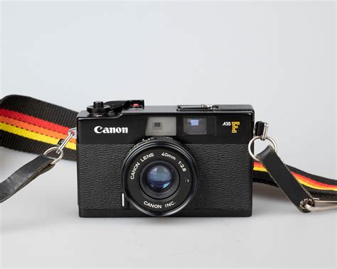 Canon A35F rangefinder 35mm camera with built-in flash w/ case (serial