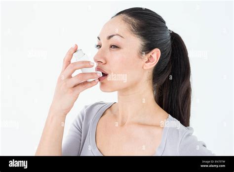 Asthmatic Pretty Brunette Using Inhaler Stock Photo Alamy