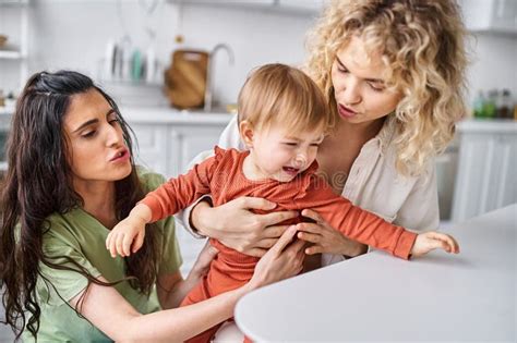 Attractive Lesbian Couple In Homewear Comforting Stock Photo Image Of Caucasian Attractive