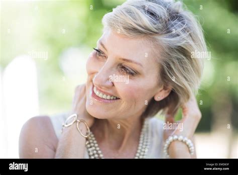 Portrait Of Smiling Mature Woman Outdoors Stock Photo Alamy
