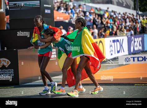 Amane Beriso Shankule And Gotytom Gebreslase With The Medals And Flags