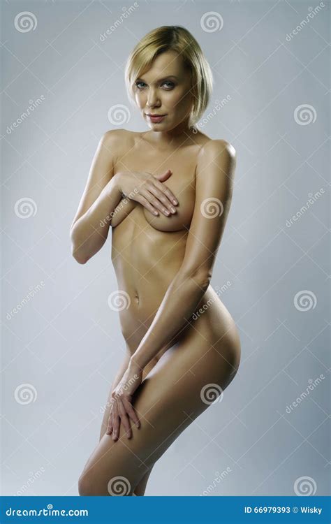 Nude Blonde Posing With Hands Covering Her Breasts Stock Image Image Of Nudity Care 66979393