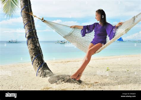 Woman In Hammock On Beach Stock Photo Alamy