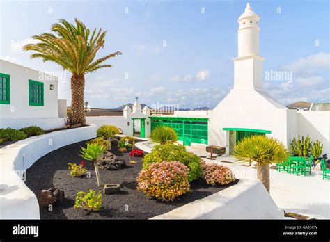 Typical Canarian Style Buildings And Tropical Plants El Campesino