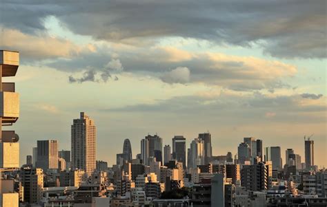 Premium Photo View Of Cityscape Against Cloudy Sky