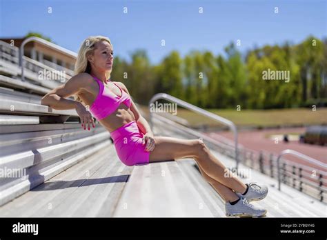 Radiant Blonde Athlete Shines At The Track On A Stunning Day Embodying Strength And Grace In