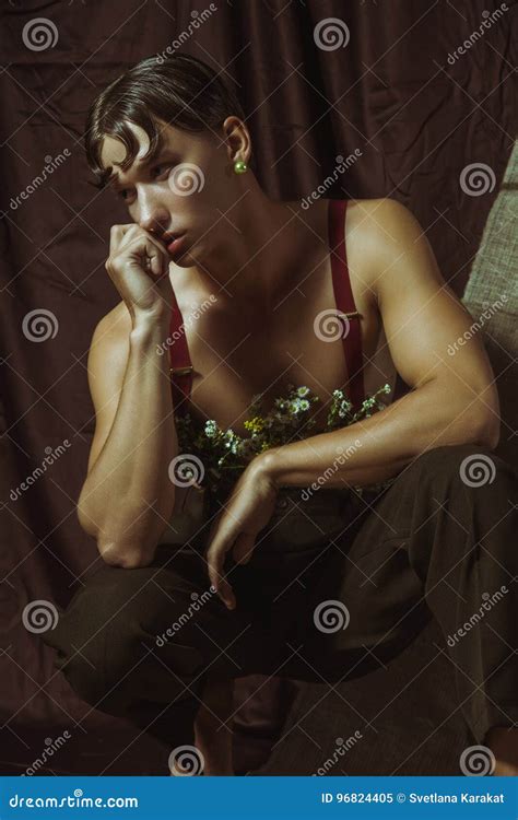 Half Naked Guy With A Beautiful Body And Flowers In His Pants Stock