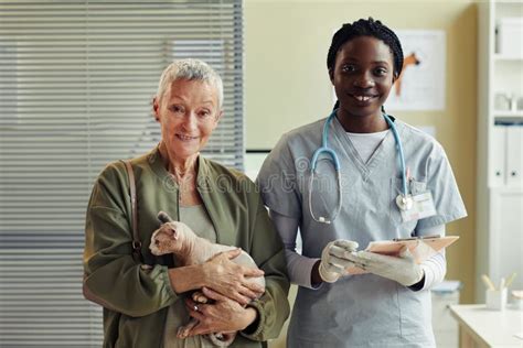 Portrait of Female Veterinarian with Client at Vet Clinic Stock Image - Image of people, exotic ...