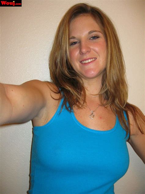 Desirable Brunette Girl Posing In Black Lingerie On The Couch Photos