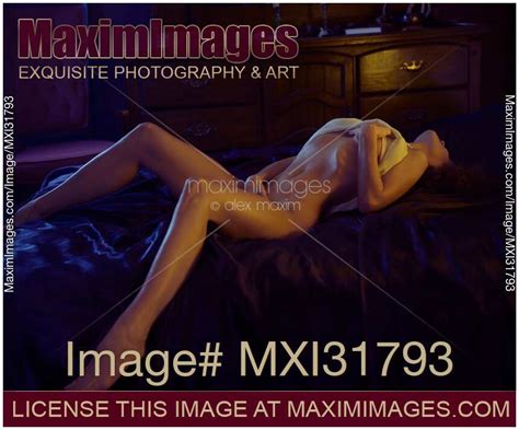 Photo Of Sensual Woman Caressing Herself Lying Half Naked With Her Body Arching Upwards On A Bed