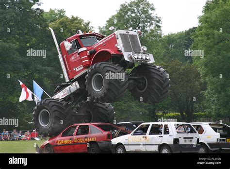 Large big wheel truck doing demonstration of power by driving at speed ...