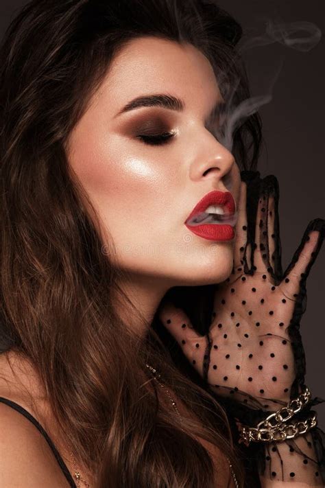 Beautiful Brunette Girl With Bright Makeup Red Lips Smoke From Mouth Beauty Face Stock Photo