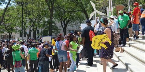 Climate Rally With Sign We Act For Environmental Justice