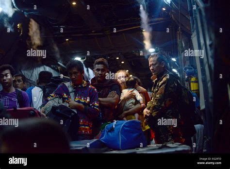A Philippine Army Soldier Watches As Evacuees From Tacloban Airport