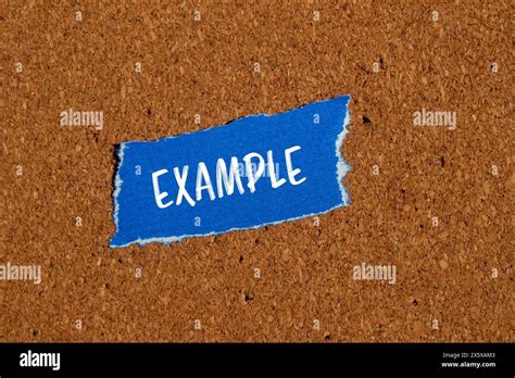 word written  ripped blue paper piece  brown background
