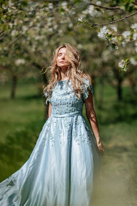Portrait Of A Blonde In The Park Beautiful Woman With Long Blond Hair