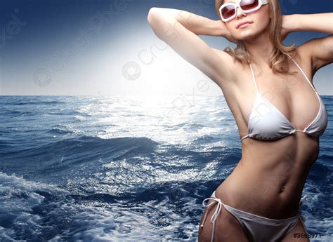 Beautiful Woman In Bikini With Sunglasses At The Sea Stock Photo