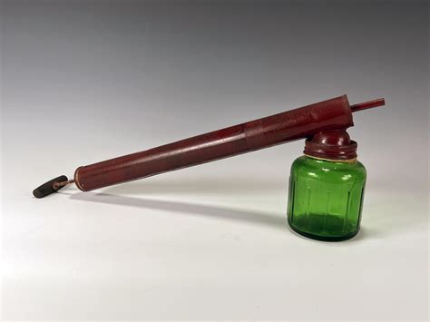 At Auction VINTAGE BUG SPRAYER WITH GREEN GLASS