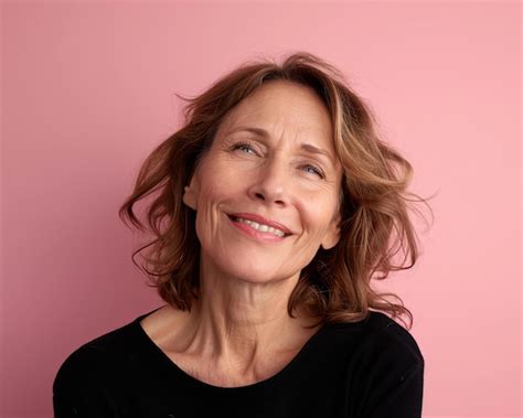 Premium Photo Portrait Of A Mature Woman On A Pink Background