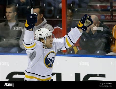 A Florida Panthers fan, right, reacts as Buffalo Sabres' Marcus Foligno ...