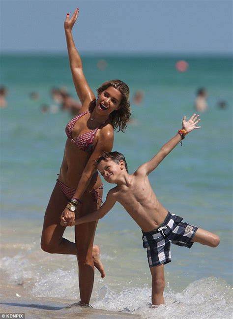 Cheerful Moments: Sylvie van der Vaart and Son Enjoying Playful Time at Miami Beach