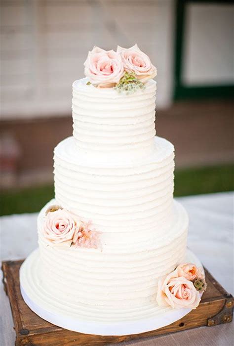 Three Tiered White Cake With Pink Flowers 2552732 Weddbook