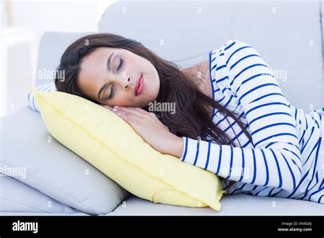 Smiling Beautiful Brunette Relaxing On The Couch Stock Photo Alamy