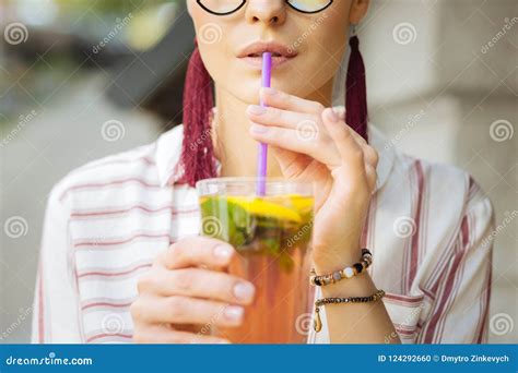 Close Up Of A Woman Drinking Lemonade With A Straw Stock Photo Image