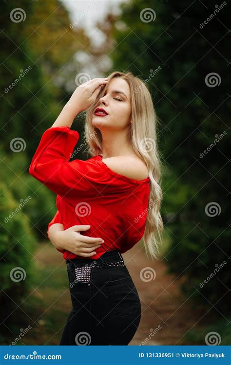 Awesome Blonde Woman In Red Blouse Posing With Naked Shoulder At Stock Image Image Of Glam