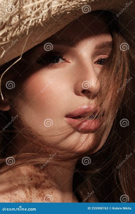 Portrait Of A Beautiful Woman In A Straw Hat Loose Hair And Nude Makeup Beauty Face Stock