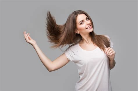 Premium Photo Portrait Of Beautiful Brunette Woman With Natural Makeup On Grey Background