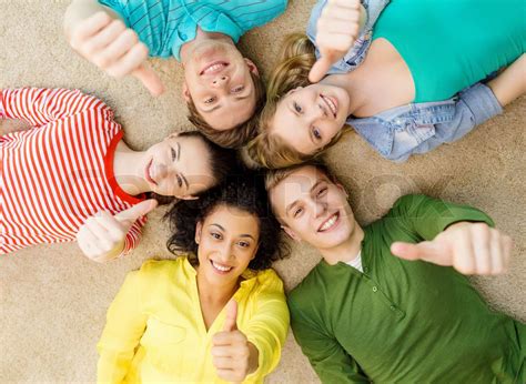 Group Of Smiling People Lying Down On Floor Stock Image Colourbox