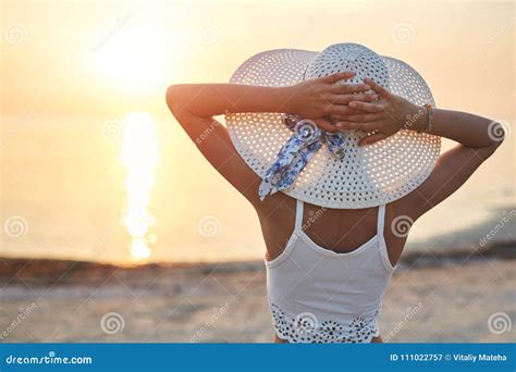 Beautiful Sexual Woman In White Hat And Bikini Against The Sea And Sunset Stock Image Image Of