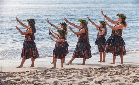 Group Of Traditional Hawaiian Hula Dancers Performing On The Beach In