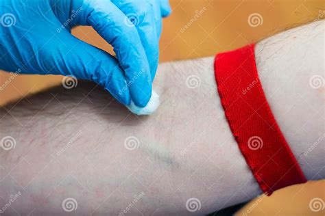 The Doctor Is Preparing The Hand Of A Man To Collecting The Blood