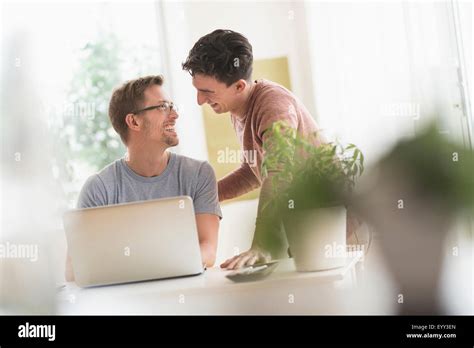 Caucasian Gay Couple Using Laptop Stock Photo Alamy