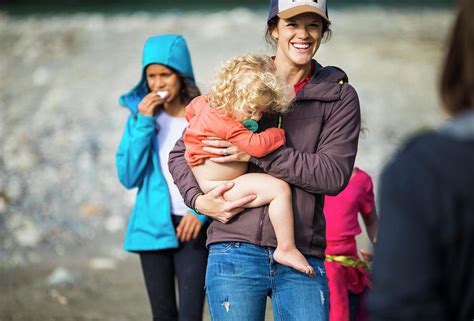 A Mother Carries Her Half Naked Baby Photograph By Christopher Kimmel