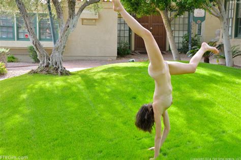 Charming Doll Emily Grey Is Performing Exciting Naked Posing On The Green Lawn DefineBabe