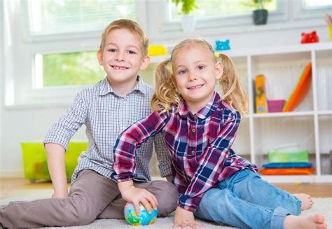 Premium Photo | Portrait of smiling kids playing at home